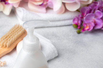 Fototapeta na wymiar Liquid soap or body lotion set at hotel bathroom, close up