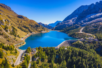 Lago Fedaia (Fedaia Lake), Fassa Valley, Trentino Alto Adige, an artificial lake and a dam near Canazei city, located at the foot of Marmolada massif. Fedaia Lake is the Province of Belluno, Italy. - obrazy, fototapety, plakaty