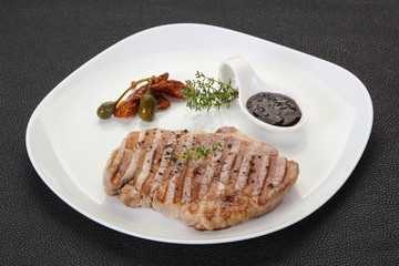 Grilled pork steak with pepper sauce