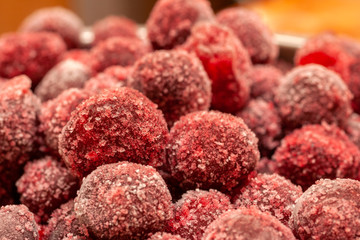 Frozen cherry fruit close up. Cherry in ice crystals.