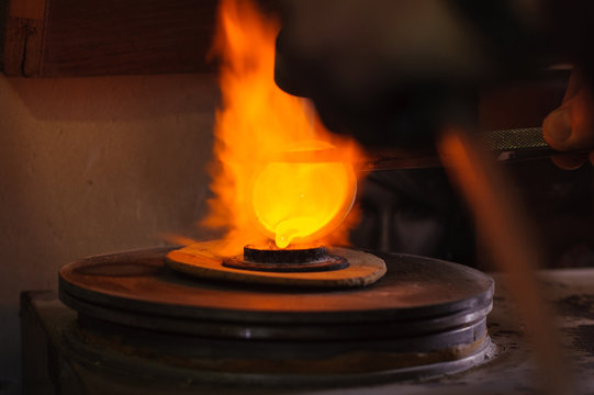 Jeweler melts metal for jewelry