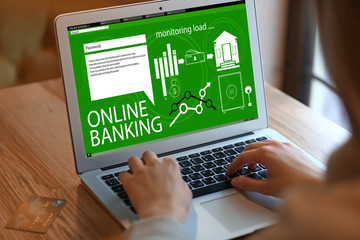 Woman using laptop for online banking at home