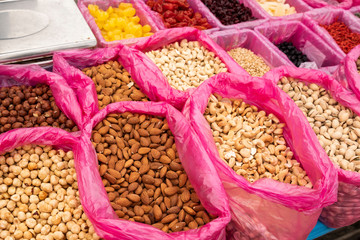 a variety of nuts and dried fruits on the market for sale