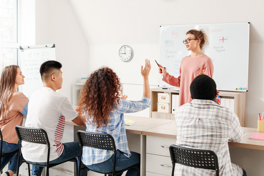 Teacher conducting lesson for students of language school