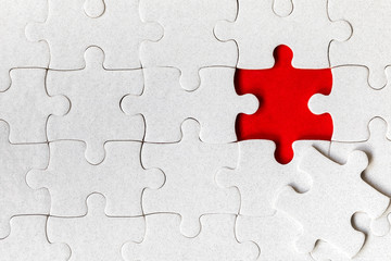 Fototapeta premium Jigsaw puzzle with missing piece. Missing puzzle pieces. Concept image of unfinished task. Completing final task, missing jigsaw puzzle pieces and business concept with a puzzle piece missing.