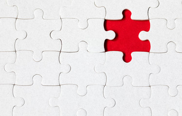 Fototapeta premium Jigsaw puzzle with missing piece. Missing puzzle pieces. Concept image of unfinished task. Completing final task, missing jigsaw puzzle pieces and business concept with a puzzle piece missing.