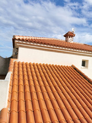 roof tile detail of a private house on a background of blue sky