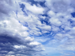 Fototapeta na wymiar cumulus clouds on a background of blue sky in clear weather