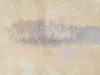 yellow concrete wall with gray stain for background or texture
