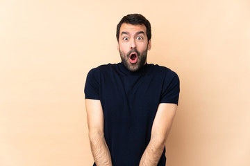 Caucasian handsome man over isolated background with surprise facial expression