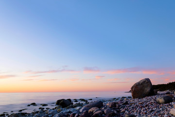 Fototapeta na wymiar Colorful spring sunset over an calm Baltic Sea outside island of Gotland, Sweden