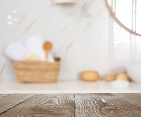 Fototapeta na wymiar Empty wooden table in bathroom. Space for text