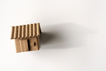 Model of cardboard house isolated white background