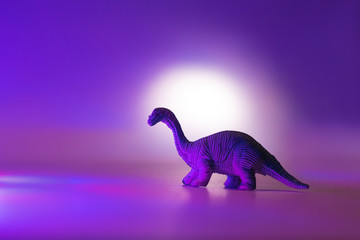 Mini dinosaurs in neon pink and blue.