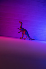 Mini dinosaurs in neon pink and blue.