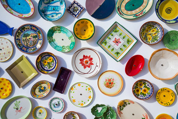 Collection of colorful Portuguese ceramic pottery, local craft products from Portugal. Ceramic...