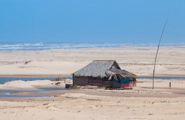 Typical houses on Praia de Cabure in the Lençois Maranhenses National Park, Maranhão, Brazil on October 12, 2006. On the north Atlantic coast of Brazil, known for its natural beauty and desert lands