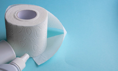 Toilet paper roll isolated on a blue background