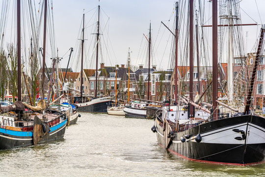 Harlingen, Nethrelands - January 10, 2020. Boats in water canal in downtown in winter