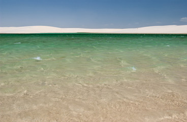 White sand dunes and seasonal lagoons in the Lençois Maranhenses National Park, Maranhão,...