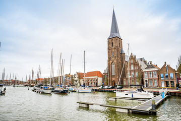 Fototapeta premium January 10, 2020. H. Aartsengel Michael kerk - Church by the water canal in winter