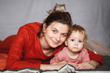 A young mother with her one-year-old little son