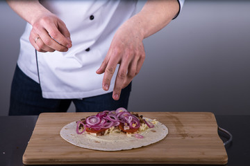 Obraz na płótnie Canvas Chef cooking shawarma in restaurant kitchen3