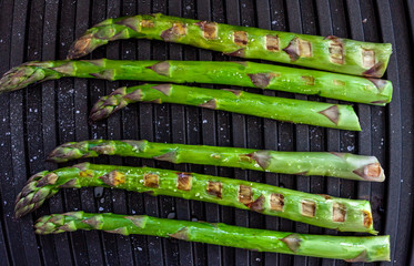 green fresh asparagus on grill