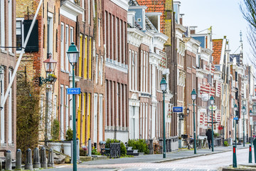 Harlingen, Netherlands - January 10, 2020. Zuiderhaven street in winter with traditional dutch houses