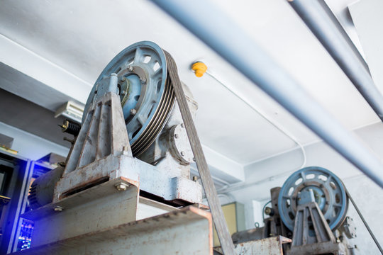 Blurry of wheel rotating with motor driven  with sling cable in control room