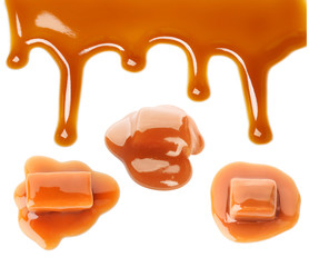 Set with caramel candies and tasty sauce on white background