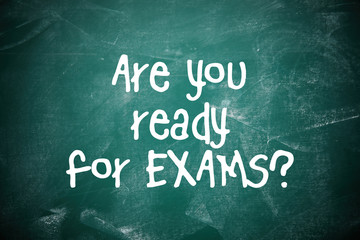 Green chalkboard with phrase ARE YOU READY FOR EXAMS as background