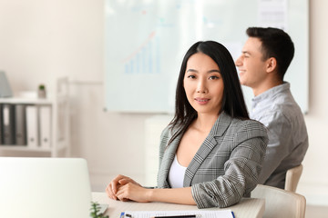 Asian businesswoman during meeting in office