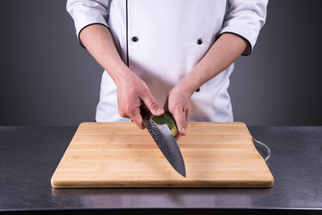 chef cuts cucumber in the restaurant kitchen3