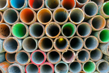 Stacking of scaffold tubes with various colours marking at the edge of tubes.