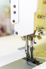 professional production sewing machine close-up, leather production, seamstress, tailor