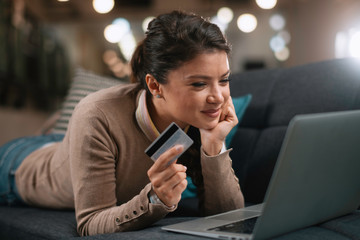 Young woman paying online. Beautiful businesswoman using e-banking	
