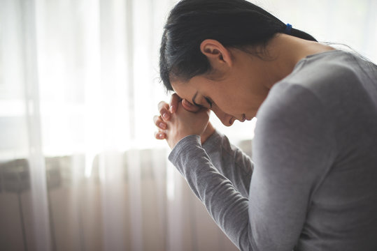 Portrait of woman praying