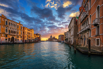 Fototapeta na wymiar Grand Canal at sunrise in Venice, Italy. Sunrise view of Venice Grand Canal. Architecture and landmarks of Venice. Venice postcard
