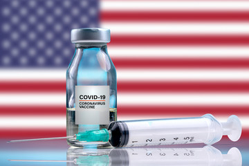 Vaccine and syringe injection. It use for prevention, immunization and treatment from corona virus infection (novel coronavirus disease 2019, Covid-19). USA Flag background