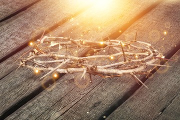 Jesus crown of thorns on the wooden desk