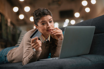 Young woman paying online. Beautiful businesswoman using e-banking	
