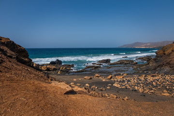 La Pared volcanic beach or Playa de La Pared on Fuerteventura south west coast, Canary Islands, Spain, with eroded landscape and black sand. October 2019
