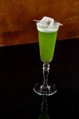 Lime daiquiri with artistic marshmallow presentation photography. Mexican beverage in casual dine in restaurant picture for book menu concept.