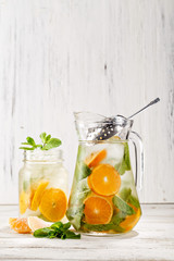 Authentic Homemade lemonade made with mixed mint and orange for bursting flavors. Beverage photography best used for restaurant book menu or promotion concept.