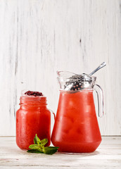 Traditional Mexican beverage refreshment in a jar and glass flavored raspberry and mint. Picture best use for Mexican restaurant book menu concept.