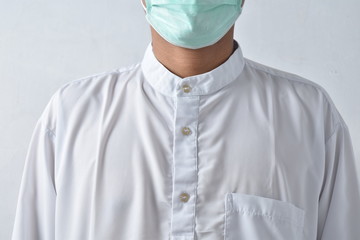 Doctor wearing protection face mask against coronavirus.