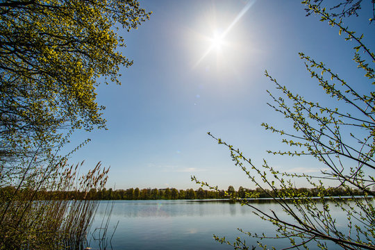 Beautiful, blue and deserted Unisee - a lake in Bremen at sun and blue sky
