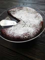 Brownie chocolate cake on dark table
