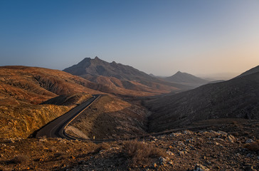 Panoramic view at volcanic landscape nearby Pajara on canary island Fuerteventura. Sunset in...